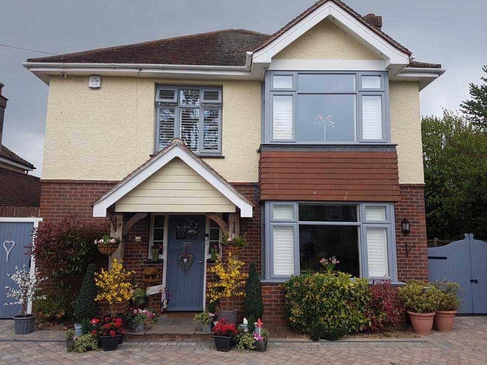 Detached home with casement front windows and porch